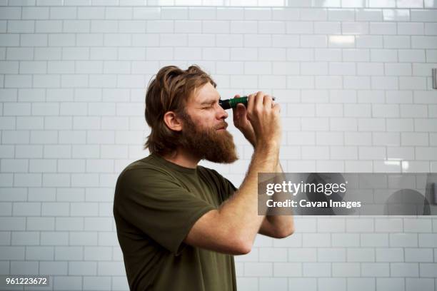brewer using refractometer at brewery - refractometer stock pictures, royalty-free photos & images