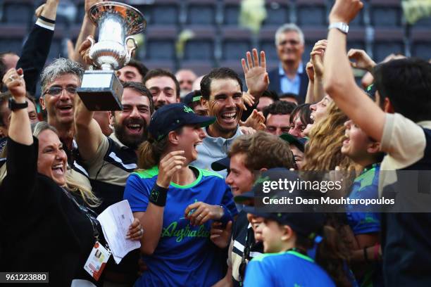 Rafael Nadal of Spain celebrates with the trophy and ground staff after victory in his Mens Final match against Alexander Zverev of Germany during...