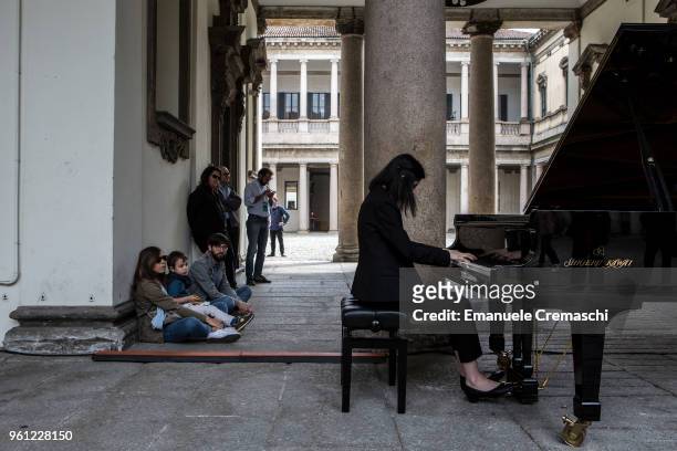 Pianist performs in the courtyard of the Archivio di Stato on May 20, 2018 in Milan, Italy. Piano City is a music festival featuring a schedule of...