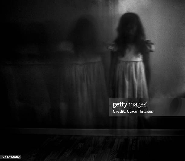 double exposure of spooky girl against wall at home - fantasma imagens e fotografias de stock