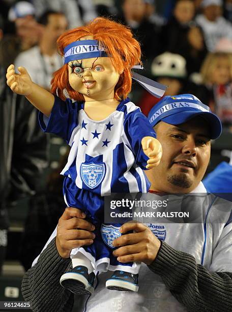 Honduran fan holds a "Chucky" doll during his teams international friendly clash against the US at the Home Depot Center Stadium in Los Angeles on...