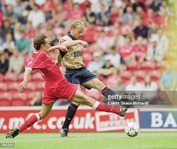 Dennis Bergkamp of Arsenal beats Gareth Southgate of Middlesbrough to score during the FA Barclaycard Premiership match at the Riverside Stadium in...