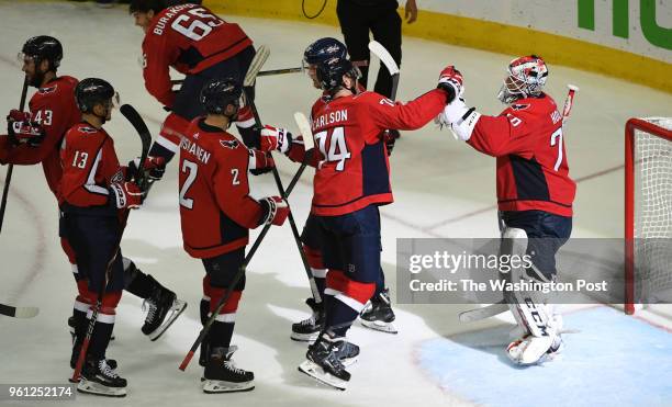 Washington Capitals defenseman John Carlson greets goaltender Braden Holtby after their 3-0 win over the Tampa Bay Lightning during game six of the...