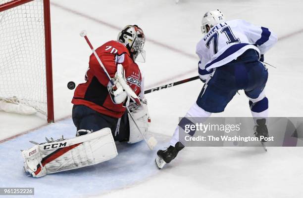 Washington Capitals goaltender Braden Holtby makes a stop against Tampa Bay Lightning center Anthony Cirelli in the second period during game six of...