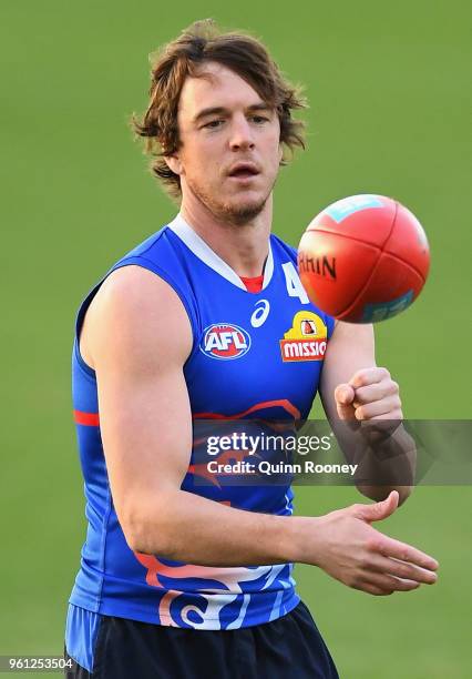 Liam Picken of the Bulldogs handballs during a Western Bulldogs AFL training session at Whitten Oval on May 22, 2018 in Melbourne, Australia.