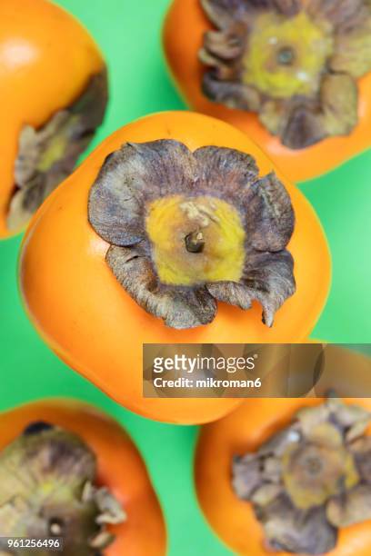 directly above shot of persimmons fruits - mikroman6 imagens e fotografias de stock