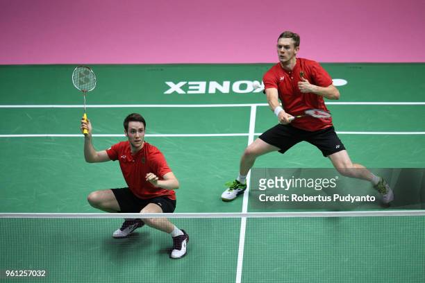 Mark Lamsfuss and Marvin Emil Seidel of Germany compete against Takeshi Kamura and Keigo Sonoda of Japan during Preliminary Round on day three of the...