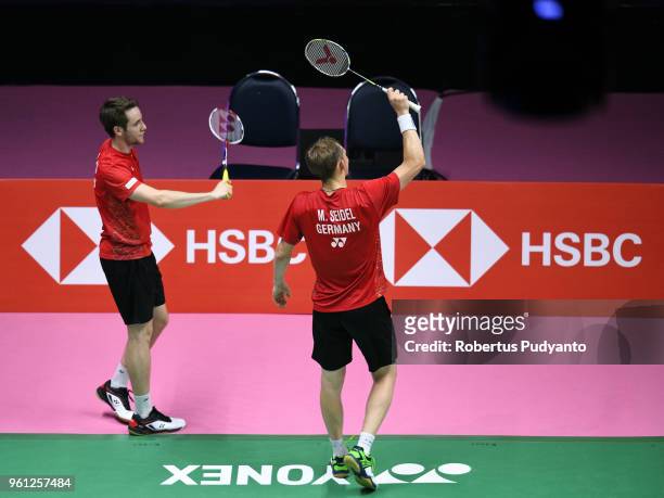 Mark Lamsfuss and Marvin Emil Seidel of Germany celebrate victory after beating Takeshi Kamura and Keigo Sonoda of Japan during Preliminary Round on...