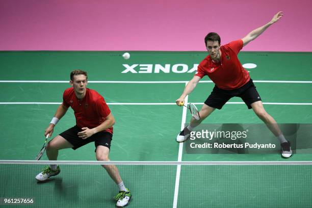 Mark Lamsfuss and Marvin Emil Seidel of Germany compete against Takeshi Kamura and Keigo Sonoda of Japan during Preliminary Round on day three of the...