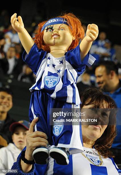 Honduran fan holds a "Chucky" doll during his teams international friendly clash against the US at the Home Depot Center Stadium in Los Angeles on...