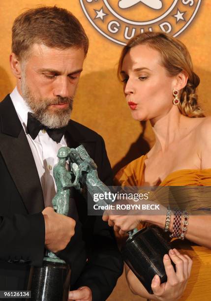 Christoph Waltz and Diane Kruger pose with their trophies for Outstanding Performance by a Cast in a Motion Picture in "Inglorious Basterds" at the...