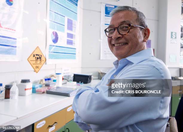 Peruvian genetics specialist Ricardo Fujita poses at his lab in the San Martin de Porres University in Lima on May 11, 2018. - Upon the many programs...