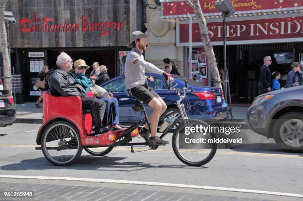 street life in san francisco - rickshaw or tuk tuk or surrey or pedicab stock pictures, royalty-free photos & images