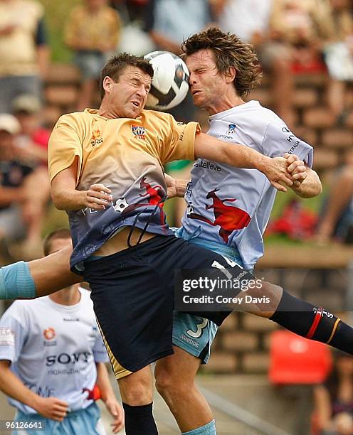 Michael Bridges of the Jets and Stephan Keller of Sydney contest the ball during the round 24 A-League match between the Newcastle Jets and Sydney FC...