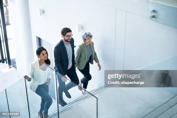 the go getters have entered the building - escadaria imagens e fotografias de stock