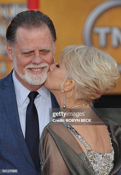 Actress Helen Mirren kisses her husband as they arrive at the 16th annual Screen Actors Guild Awards at the Shrine Exposition Center in Los Angeles...