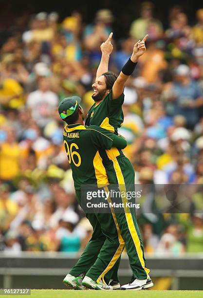 Shahid Afridi of Pakistan celebrates with Kamran Akmal after taking the wicket of Shane Watson of Australia during the second One Day International...