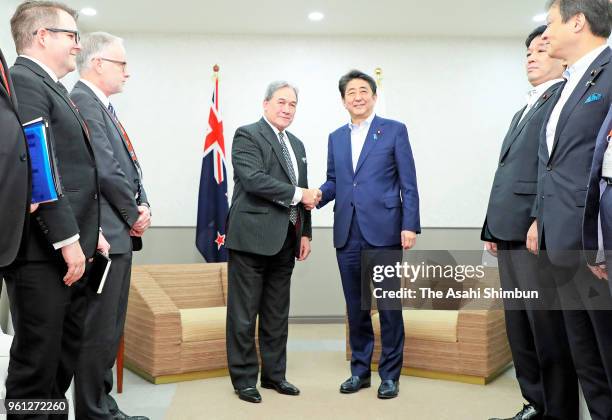 New Zealand Deputy Prime Minister Winston Peters and Japanese Prime Minister Shinzo Abe shake hands prior to their bilateral meeting on the sidelines...