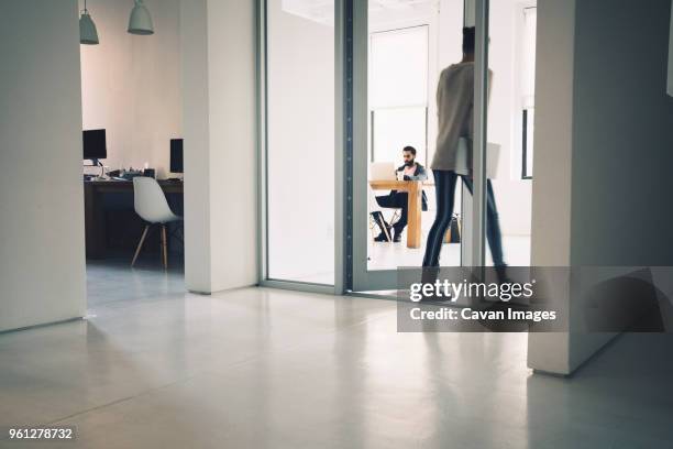 businesswoman entering in office - office door stock pictures, royalty-free photos & images