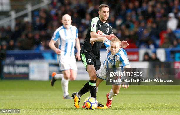 Huddersfield Town's Alex Pritchard and AFC Bournemouth's Dan Gosling battles for the ball during the Premier League match at the John Smith's...