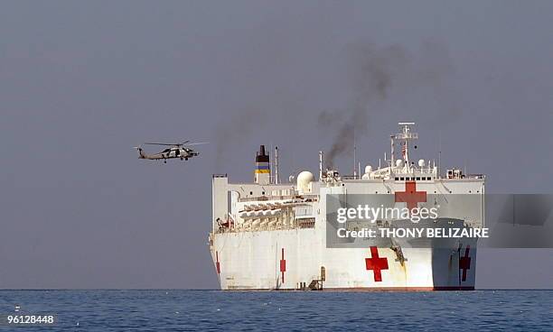 Helicopter lands on the USNS Comfort hospital ship in the harbour off Port-au-Prince on January 23, 2010. More than 110,000 people have been...