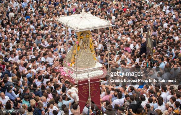 Pilgrims gather around the statue of the Rocio Virgin during the procession in the village of El Rocio on May 21, 2018 in El Rocio, Spain. El Rocio...