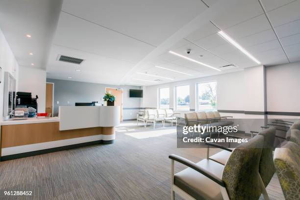 chairs arranged in hospital waiting room - hospital reception stock pictures, royalty-free photos & images