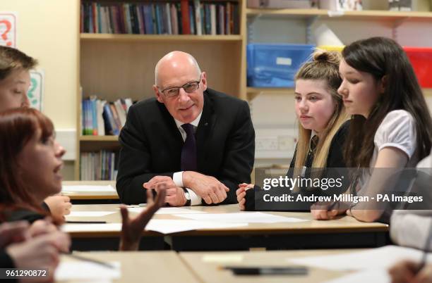 Education Secretary John Swinney sits in a class at Clydebank High School in Clydebank where he announced Scottish Attainment Challenge funding.