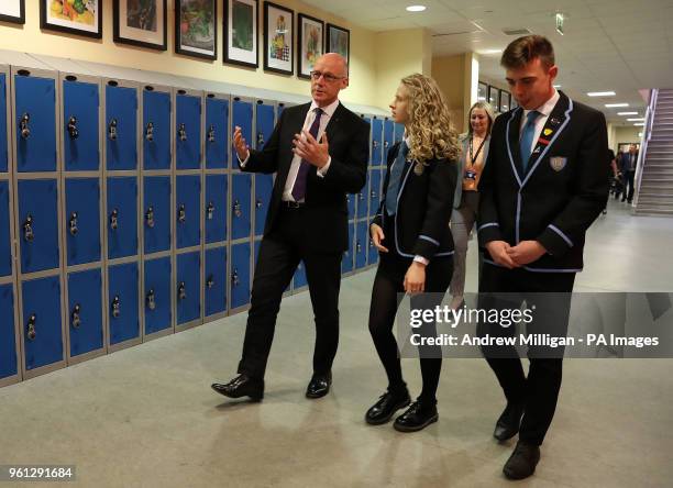 Education Secretary John Swinney with pupils Paige Dunlop and Michael Irwin at Clydebank High School in Clydebank where he announced Scottish...