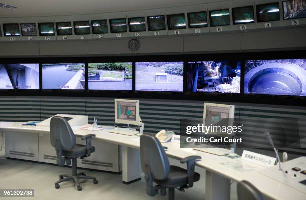 Screens showing different areas of the facility are pictured in the control room of the Tokyo Metropolitan Area Outer Underground Discharge Channel...