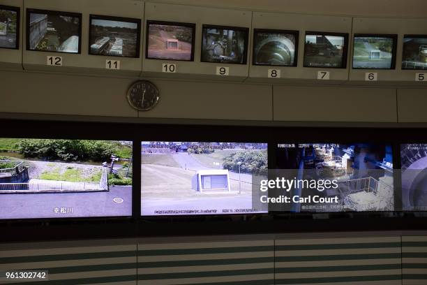 Screens showing different areas of the facility are pictured in the control room of the Tokyo Metropolitan Area Outer Underground Discharge Channel...