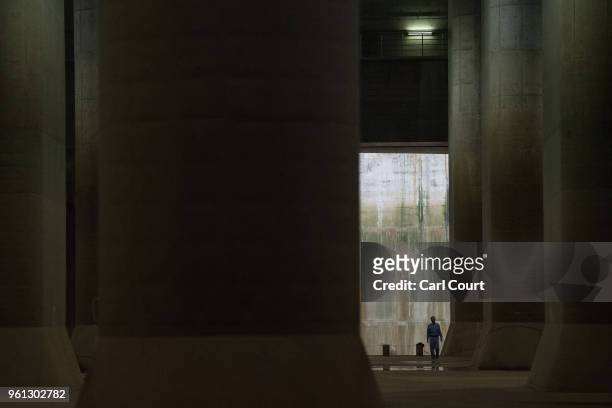 Member of staff walks through the pressure-adjusting water tank of the Tokyo Metropolitan Area Outer Underground Discharge Channel is pictured on May...