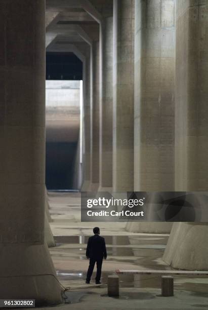 Member of a VIP delegation waits in the pressure-adjusting water tank of the Tokyo Metropolitan Area Outer Underground Discharge Channel on May 22,...