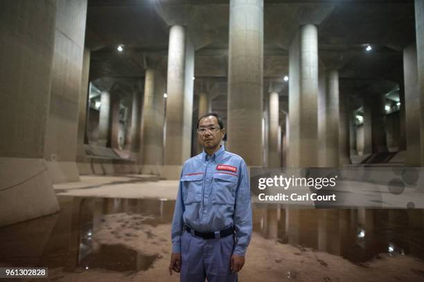 Yasuyuki Osa, a Section Manager, poses for a photograph in the pressure-adjusting water tank of the Tokyo Metropolitan Area Outer Underground...