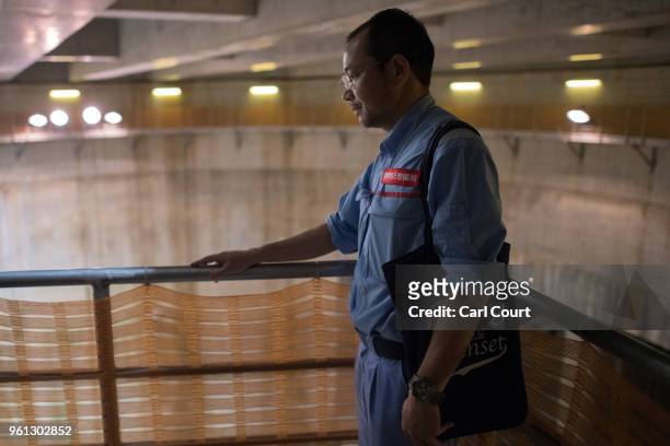Yasuyuki Osa, a Section Manager, poses for a photograph near the pressure-adjusting water tank of the Tokyo Metropolitan Area Outer Underground...