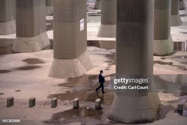 Member of a VIP delegation waits in the pressure-adjusting water tank of the Tokyo Metropolitan Area Outer Underground Discharge Channel on May 22,...