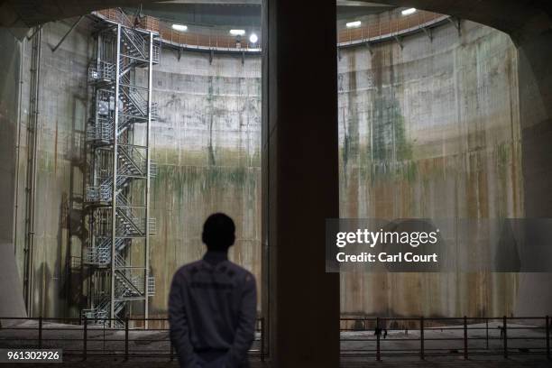 Yasuyuki Osa, a Section Manager, poses for a photograph in the pressure-adjusting water tank of the Tokyo Metropolitan Area Outer Underground...