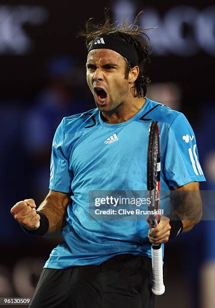 Fernando Gonzalez of Chile celebrates winning a point in his fourth round match against Andy Roddick of the United States of America during day seven...