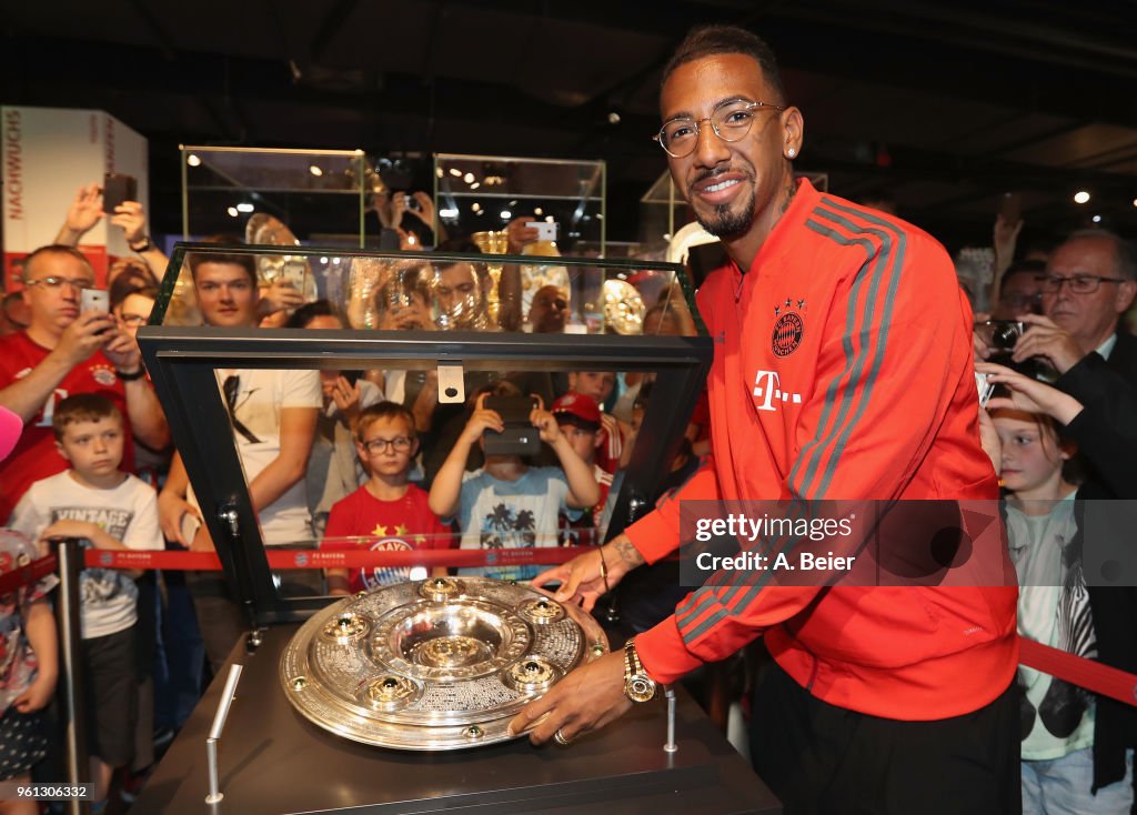 Jerome Boateng Hands Over German Championship Trophy To FCB Erlebniswelt