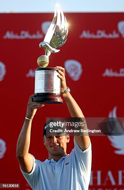 Martin Kaymer of Germany poses with the trophy after winning The Abu Dhabi Golf Championship at Abu Dhabi Golf Club on January 24, 2010 in Abu Dhabi,...