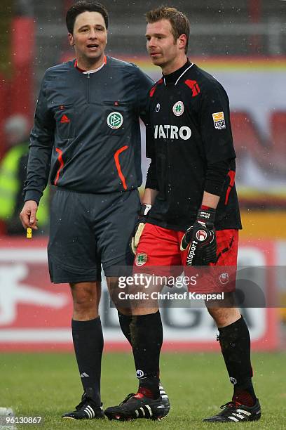 Referee Christian Schoessling sends goalkeeper Soeren Pirson of Oberhausen off the pitch during the Second Bundesliga match between RW Oberhausen and...