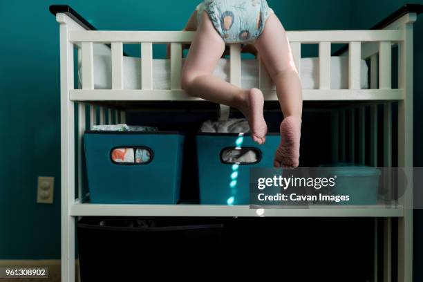 low section of boy climbing bunkbed at home - kids in bunk bed stock pictures, royalty-free photos & images