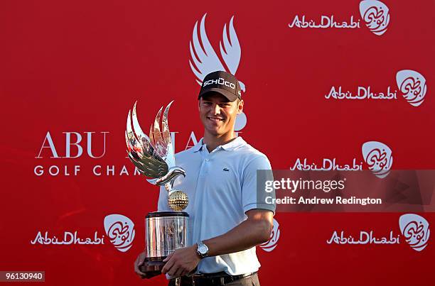 Martin Kaymer of Germany poses with the trophy after winning The Abu Dhabi Golf Championship at Abu Dhabi Golf Club on January 24, 2010 in Abu Dhabi,...