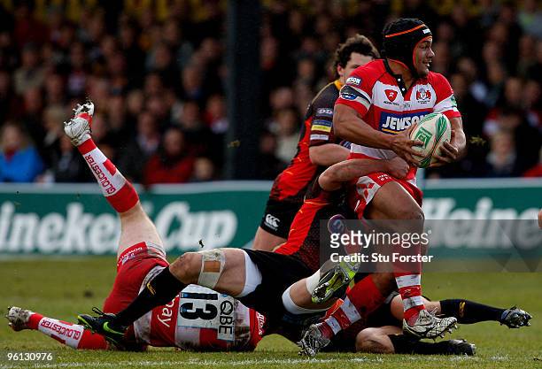 Gloucester centre Eliota Fuimaono-Sapolu breaks a tackle to set up the first Gloucester try during the Heineken Cup Pool 2, Round 6 match between...