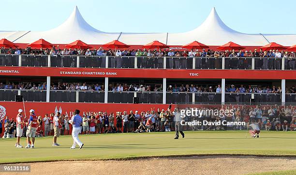 Martin Kaymer of Germany acknowledges the crowds after he had secured a one shot victory over Ian Poulter of England with a birdie 4, at the par 5,...