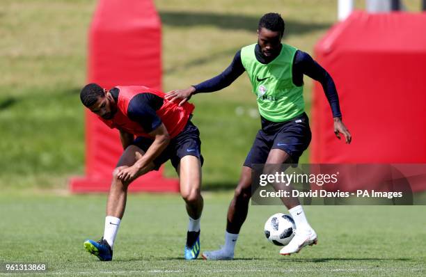 England's Ruben Loftus-Cheek and Nathaniel Chalobah battle for the ball during the training session at St George's Park, Burton.