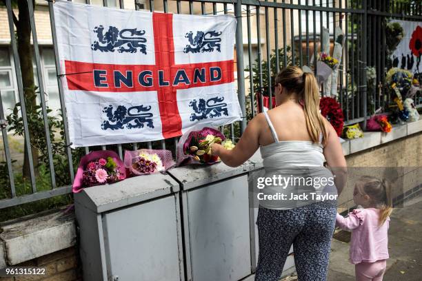 Woman leaves floral tributes at the site of the murder of Fusilier Lee Rigby on the fifth anniversary on May 22, 2018 in London, England. 25-year-old...