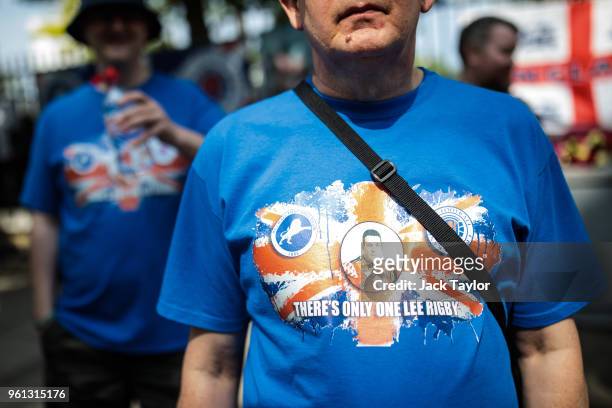 People wearing commemorative t-shirts pay their respects at site of the murder of Fusilier Lee Rigby on the fifth anniversary of his death on May 22,...