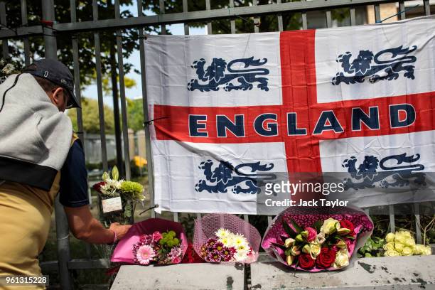 Woman leaves floral tributes at the site of the murder of Fusilier Lee Rigby on the fifth anniversary on May 22, 2018 in London, England. 25-year-old...