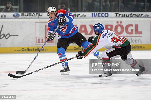 Jesse Schultz of Nurmberg in action with Benedikt Kohl of Augsburg during the DEL metch between Thomas Sabo Ice Tigers and Augsburger Panther at the...